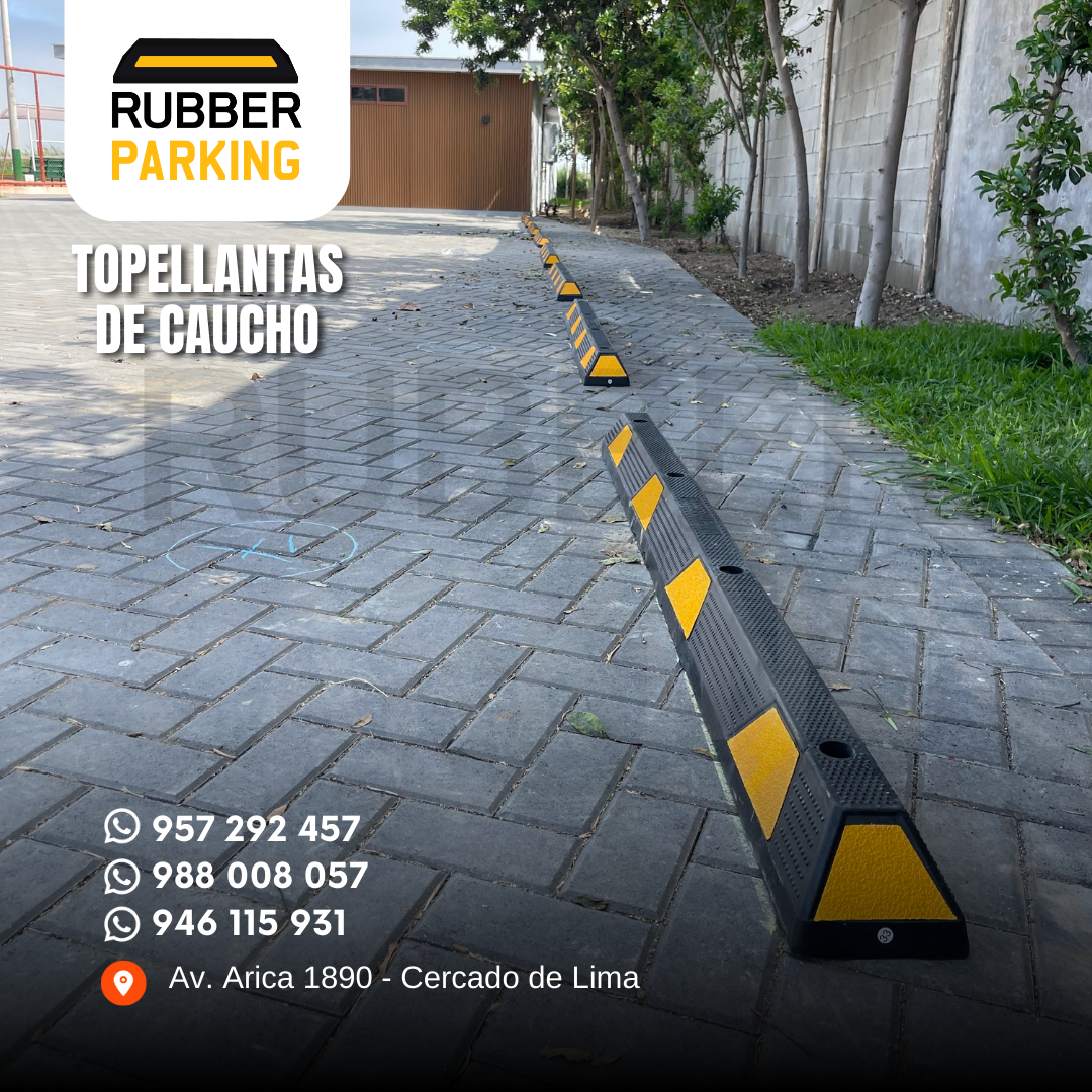 Topellanta de caucho de 1.80 m instalada sobre adoquines en una cochera exterior